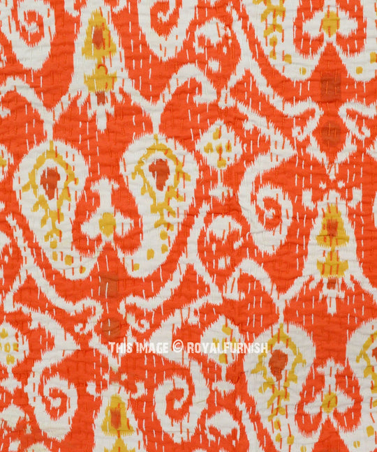 Orange and white ikat design Kantha blanket with hand-stitched quilting, lightweight cotton voile fabric, and traditional Kantha embroidery.