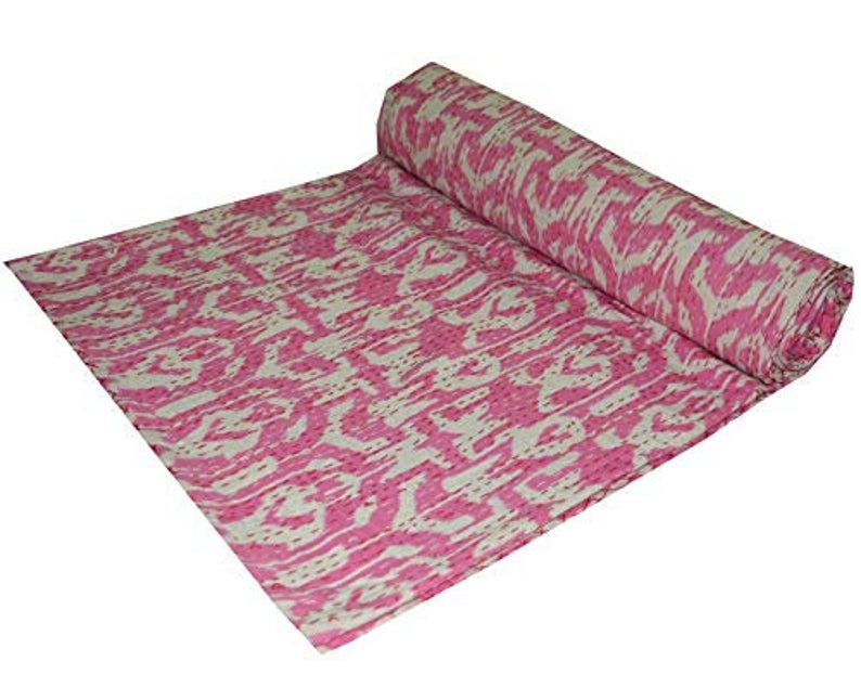 Pink and white Ikat design Kantha blanket folded and laid out, handmade 100% cotton voile quilt set.