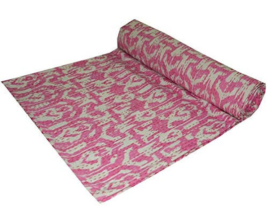 Pink and white Ikat design Kantha blanket folded and laid out, handmade 100% cotton voile quilt set.