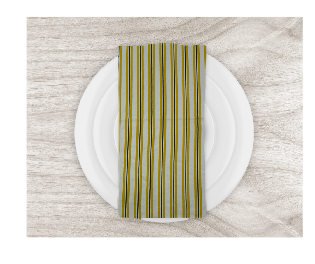 cotton table linen striped napkin on white plate over wooden table surface