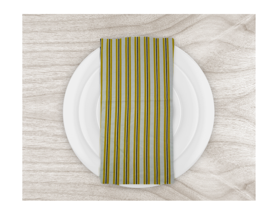 cotton table linen striped napkin on white plate over wooden table surface