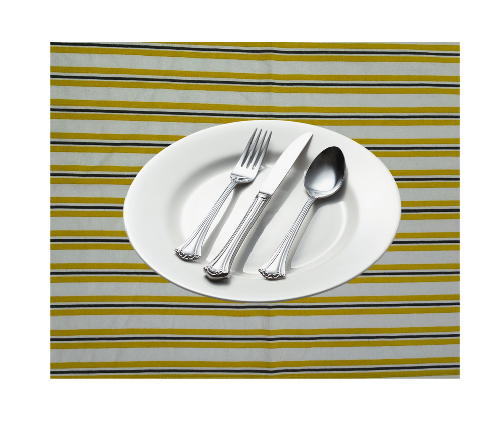 Cotton table linen striped with white plate and silver cutlery set