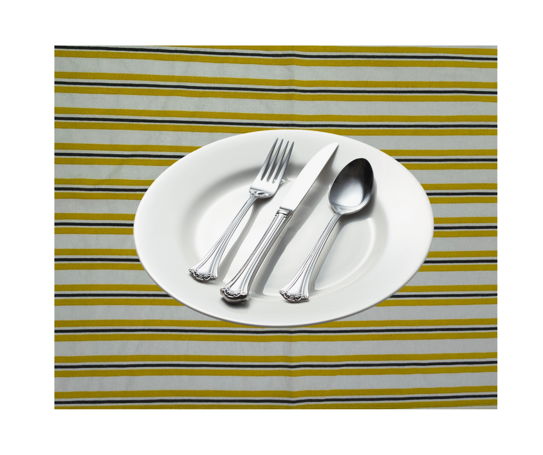 Cotton table linen striped with white plate and silver cutlery set