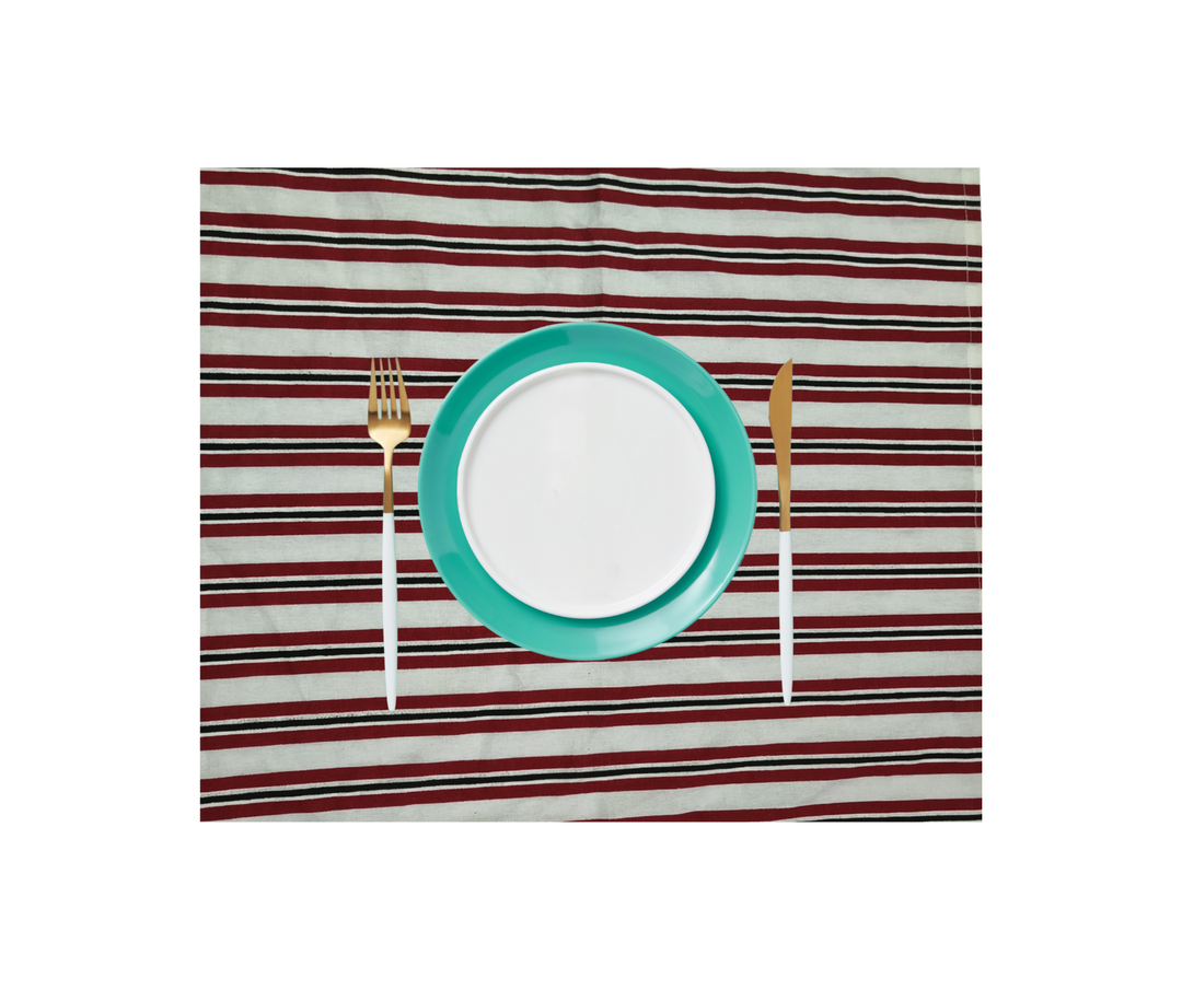 cotton table linen striped with turquoise plate and gold cutlery on white background