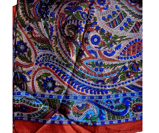 hand-hemmed lightweight silk scarf with intricate paisley pattern in vibrant blue, green, and orange tones